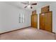 This bedroom includes a ceiling fan, closet, and window for natural light at 18829 Starry St, Orlando, FL 32833