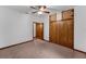 Bedroom features a ceiling fan and a closet with wood doors at 18829 Starry St, Orlando, FL 32833