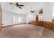 Open living room features carpet, vaulted ceilings, and a bright open space at 18829 Starry St, Orlando, FL 32833