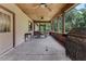 Covered porch with a ceiling fan, a picnic table and grill at 18829 Starry St, Orlando, FL 32833