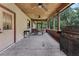 Large screened porch with ceiling fans, room for dining, and a grill at 18829 Starry St, Orlando, FL 32833