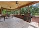Spacious screened porch with a picnic table and large gas grill at 18829 Starry St, Orlando, FL 32833