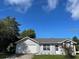 Charming one-story house with a two-car garage, gray siding, and a well-manicured front yard at 626 Nardello Dr, Deltona, FL 32725