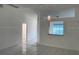Bright living room with tile floors and a partial view of the kitchen at 626 Nardello Dr, Deltona, FL 32725