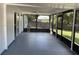 Spacious sunroom with screened windows and a ceiling fan, perfect for enjoying the outdoors at 626 Nardello Dr, Deltona, FL 32725