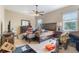 Bedroom with a ceiling fan and cluttered with various items on the bed and floor at 3221 Dark Sky Dr, Harmony, FL 34773