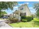 Charming two-story home with a welcoming front porch and well-manicured landscaping at 3221 Dark Sky Dr, Harmony, FL 34773