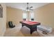 This game room features a pool table and a ceiling fan at 3221 Dark Sky Dr, Harmony, FL 34773