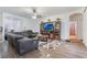 Comfortable living room with a ceiling fan and open access to other rooms at 3221 Dark Sky Dr, Harmony, FL 34773