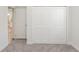 Carpeted bedroom with large closet doors at 13 Haddock Way, Poinciana, FL 34759