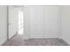 Bedroom featuring carpeted floors and a double door closet with an open view at 13 Haddock Way, Poinciana, FL 34759