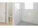 Elegant shower with marble tiling and modern fixtures at 13 Haddock Way, Poinciana, FL 34759