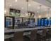 Community clubhouse bar features marble counters, dark-wood accents, and multiple tv screens at 8882 Geneve Ct, Kissimmee, FL 34747