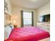 Comfortable bedroom features a cozy bed, a television, and neutral decor for a relaxing retreat at 8882 Geneve Ct, Kissimmee, FL 34747