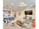 Open concept living area with sofa, kitchen with granite countertops, and stainless steel appliances at 8882 Geneve Ct, Kissimmee, FL 34747