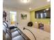 The living room features a comfortable sofa, a large television, and modern decor for relaxation and entertainment at 8882 Geneve Ct, Kissimmee, FL 34747