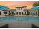 Luxury community pool features blue umbrellas and ample poolside seating at 8882 Geneve Ct, Kissimmee, FL 34747