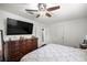 Bedroom featuring a bed, hardwood floor, and overhead fan and light at 1143 Ne 23Rd St, Ocala, FL 34470