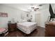 Bedroom features a bed, nightstand, dressers, hardwood floor, and overhead light at 1143 Ne 23Rd St, Ocala, FL 34470