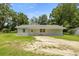 Charming single-story home with a well-maintained lawn and inviting front entrance at 1143 Ne 23Rd St, Ocala, FL 34470