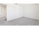 An empty bedroom with plush carpeting and neutral paint at 2222 Oklahoma Dr, Sumterville, FL 33585
