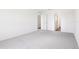 Spacious bedroom with neutral carpet and bright, natural light at 2222 Oklahoma Dr, Sumterville, FL 33585