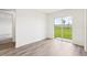 Bright living room with sliding glass doors leading to the backyard at 2222 Oklahoma Dr, Sumterville, FL 33585