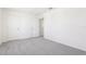 Bedroom with gray carpet and two doors at 2228 Oklahoma Dr, Sumterville, FL 33585