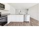 Bright, modern kitchen features white cabinets, stainless appliances, and stylish countertops at 2228 Oklahoma Dr, Sumterville, FL 33585