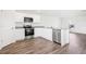 Well-lit kitchen featuring stainless steel appliances and ample storage and countertop space at 2228 Oklahoma Dr, Sumterville, FL 33585