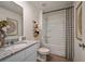 Modern bathroom with granite countertop, stylish fixtures, and a shower-tub combination, creating a functional space at 2383 Oklahoma Dr, Sumterville, FL 33585