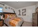 Charming bedroom with soccer-themed decor and a comfortable bed, perfect for a sports enthusiast at 2383 Oklahoma Dr, Sumterville, FL 33585