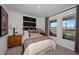 Serene bedroom with two bright windows and neutral decor, providing a tranquil and relaxing space at 2383 Oklahoma Dr, Sumterville, FL 33585