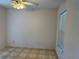 Bedroom with ceiling fan, neutral paint, and window for natural light at 1152 Mccormick Dr, Deltona, FL 32725