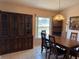 A view of dining area, featuring a china cabinet and table with seating at 1152 Mccormick Dr, Deltona, FL 32725