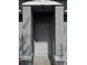Front door with a security screen, framed by stone pillars and overhead lighting at 1152 Mccormick Dr, Deltona, FL 32725