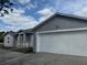 Charming single Gathering home with a two car garage and light-grey colored stucco siding at 1152 Mccormick Dr, Deltona, FL 32725