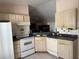 Functional kitchen includes appliances, cabinets, and countertops at 1152 Mccormick Dr, Deltona, FL 32725