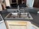 Close-up of the kitchen sink with stainless steel fixtures and laminate countertops at 1152 Mccormick Dr, Deltona, FL 32725