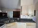 Kitchen area showcasing countertops, sink, cabinets, and view into living area at 1152 Mccormick Dr, Deltona, FL 32725