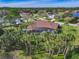 Home with pool and cabana, surrounded by palm trees at 109 La Toscana Rotonda, Ormond Beach, FL 32174