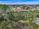 Single Gathering home with palm trees and lake view at 109 La Toscana Rotonda, Ormond Beach, FL 32174