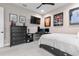 Bedroom featuring a bed, desk, and framed jersey at 109 La Toscana Rotonda, Ormond Beach, FL 32174