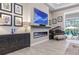 Living room fireplace with dark wood mantel and art at 109 La Toscana Rotonda, Ormond Beach, FL 32174