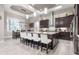 Modern kitchen with dark cabinetry, granite counters, and island at 109 La Toscana Rotonda, Ormond Beach, FL 32174