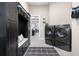 Laundry room with washer, dryer, and built-in storage at 109 La Toscana Rotonda, Ormond Beach, FL 32174