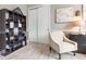 Bright home office featuring built-in shelving and comfortable seating at 109 La Toscana Rotonda, Ormond Beach, FL 32174