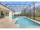 Relaxing pool area with covered patio and string lights at 109 La Toscana Rotonda, Ormond Beach, FL 32174