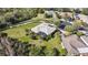 Aerial view of the property showcasing a large, landscaped yard with screened-in lanai and neighborhood at 112 Sevilla Ct, Poinciana, FL 34759