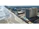 Oceanfront view of a residential condo building with a swimming pool and beach access at 2071 S Atlantic Ave # 201, Daytona Beach Shores, FL 32118